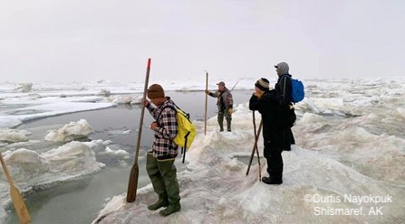 Walking across the ice with search and rescue.